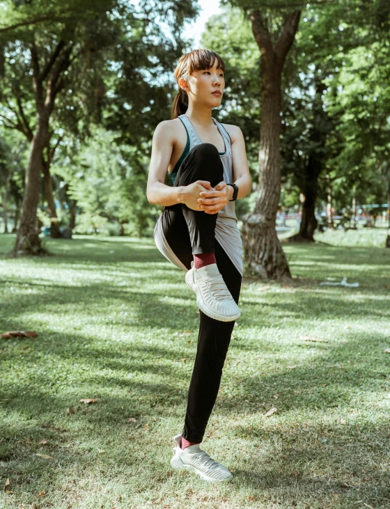 a woman doing a yoga pose in a park, by Adam Rex, heroic muay thai stance pose, cai xukun, 🐝👗👾, leggings