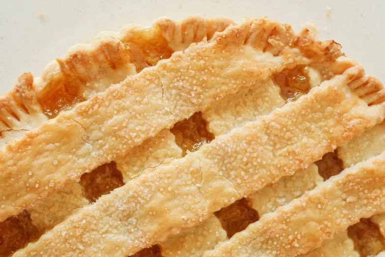 a close up of a pie on a table, lattice, crackles, slide show, fan favorite