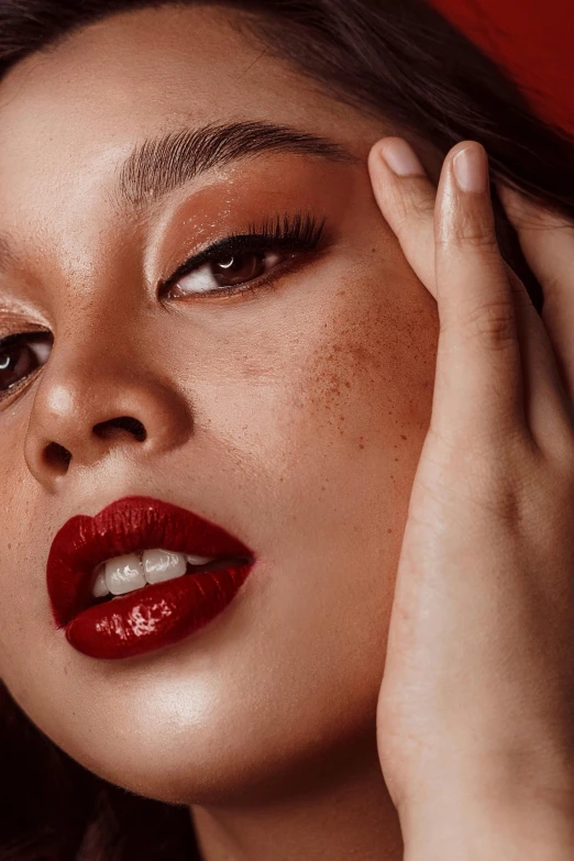 a close up of a woman with red lipstick, by Cosmo Alexander, trending on pexels, renaissance, wlop glossy skin, with freckles, model posing, cinnamon skin color