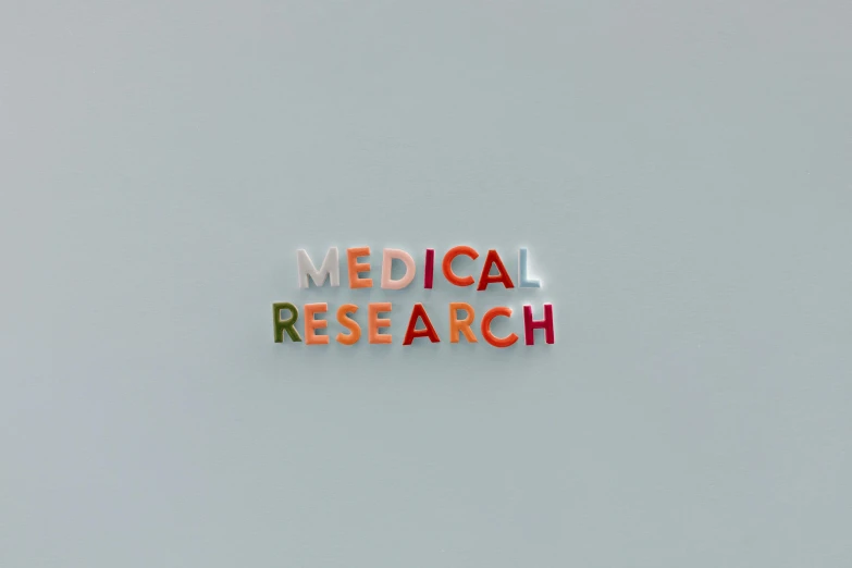 a close up of a sign that says medical research, an album cover, by Emma Andijewska, pexels, conceptual art, on simple background, gif, microscopic photo, 3 4 5 3 1