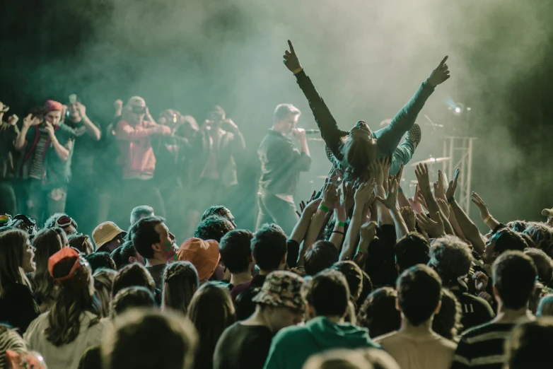 a crowd of people standing on top of a stage, pexels contest winner, happening, jesus wasted at a party, stoner rock concert, thumbnail, spiderman in the moshpit