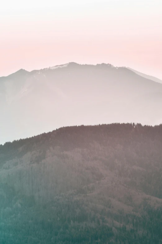 a view of the mountains from the top of a hill, a picture, inspired by Andreas Gursky, trending on unsplash, romanticism, pastel palette silhouette, tochigi prefecture, low quality photo, whistler