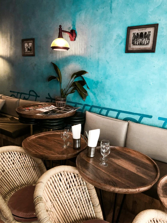 a room filled with lots of tables and chairs, a portrait, trending on unsplash, ocher and turquoise colors, very smoky paris bar, thumbnail, textured