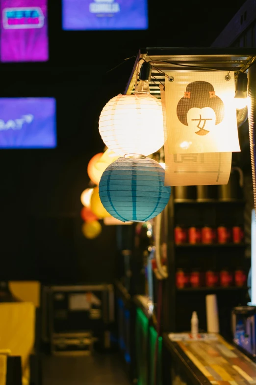 a restaurant with a lot of lights hanging from the ceiling, a picture, by Miyamoto, unsplash, mingei, japanese maid cafe, with paper lanterns, 2 5 6 x 2 5 6 pixels, cocktail bar