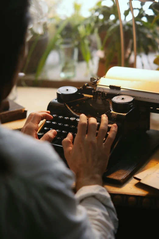 a person typing on a typewriter at a desk, handcrafted, thumbnail, abcdefghijklmnopqrstuvwxyz, multiple stories