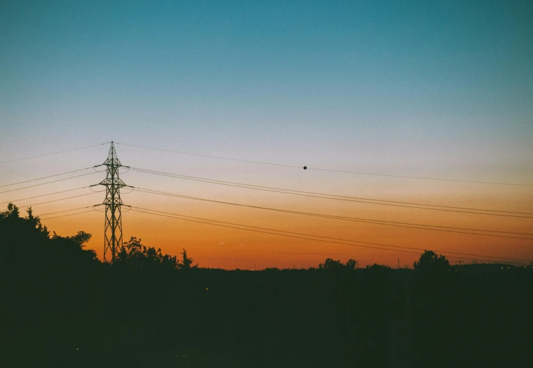 a view of a sunset with power lines in the foreground, an album cover, inspired by Elsa Bleda, postminimalism, nature photo, summer night, ((sunset)), colored photography
