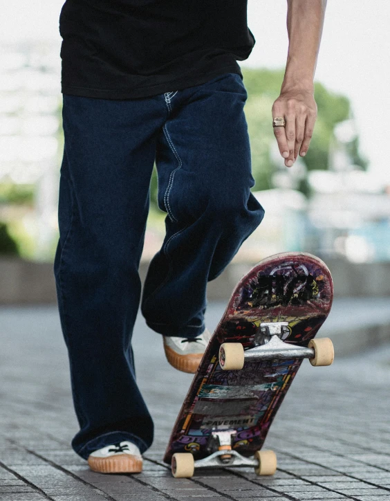 a man riding a skateboard down a sidewalk, a picture, baggy pants, large pants, highly upvoted, product introduction photo