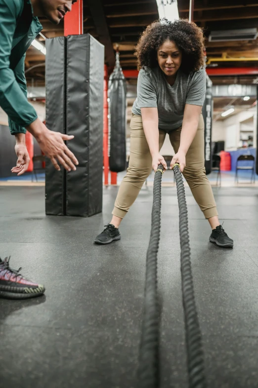 a group of people working out with ropes in a gym, by Jessie Algie, pexels contest winner, two people, scaly, thicc, instagram story