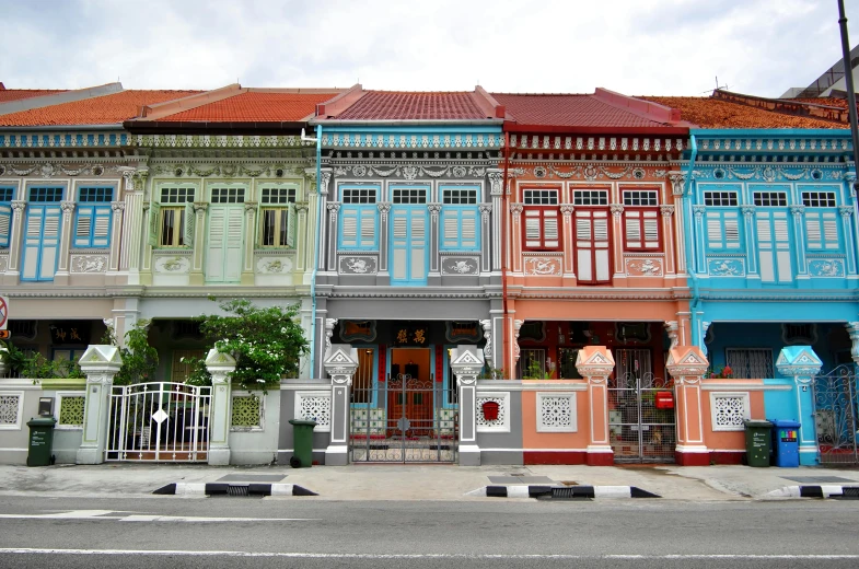 a row of colorful buildings on a city street, inspired by Ina Wong, pexels contest winner, art nouveau, singapore, grey, square, hindu aesthetic