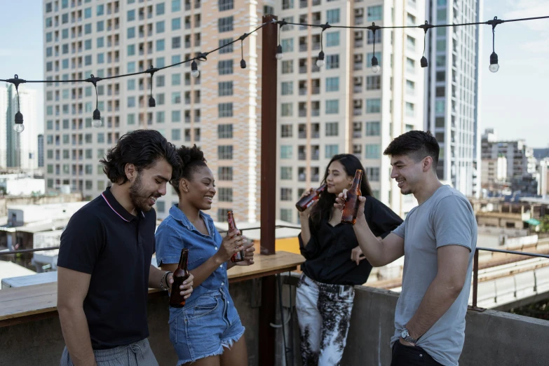 a group of people standing on top of a roof, drinking at the bar, profile image