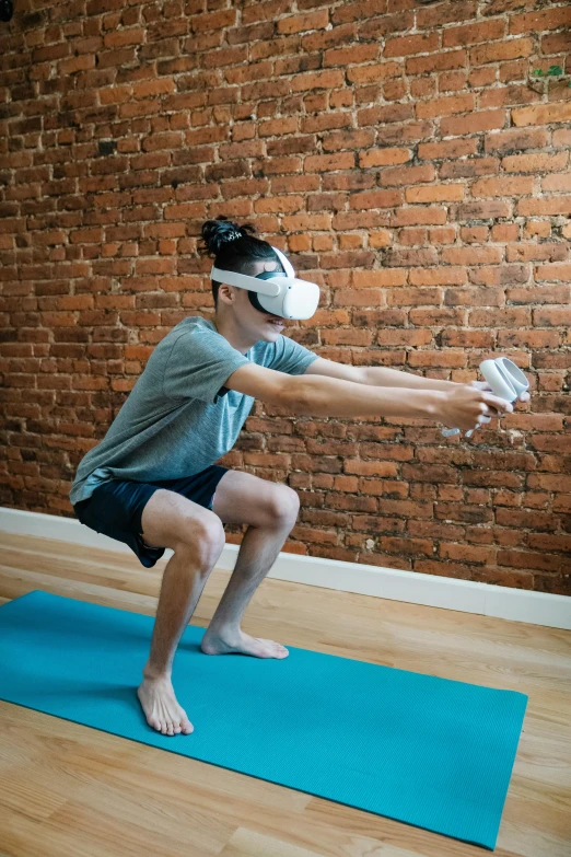 a man standing on a yoga mat in front of a brick wall, a hologram, reddit, using a vr headset, akali, upper body image, leslie zhang