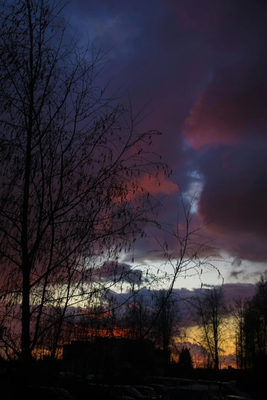a sunset with clouds and trees in the foreground, a picture, by Anato Finnstark, romanticism, dramatic lighting - n 9, red and purple, cold colours, today\'s featured photograph 4k