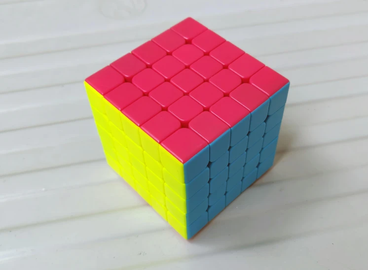 a rubik cube sitting on top of a table, 5 4 s, turquoise pink and yellow, without duplication, 4 0 mp