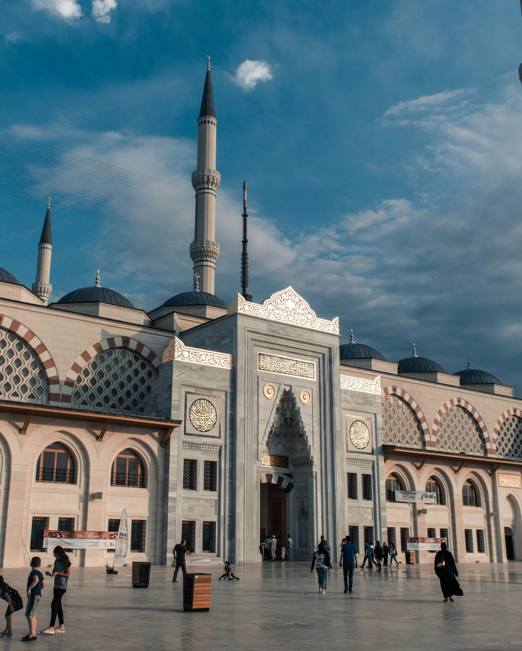 a group of people walking in front of a large building, a marble sculpture, by Ismail Acar, pexels contest winner, hurufiyya, he is in a mosque, turkish and russian, non-binary, square