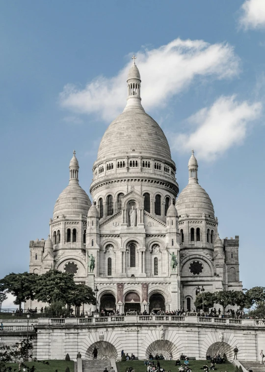 a large white building sitting on top of a lush green hillside, a colorized photo, pexels contest winner, art nouveau, background basilica! sacre coeur, frontal view, 2022 photograph, panorama