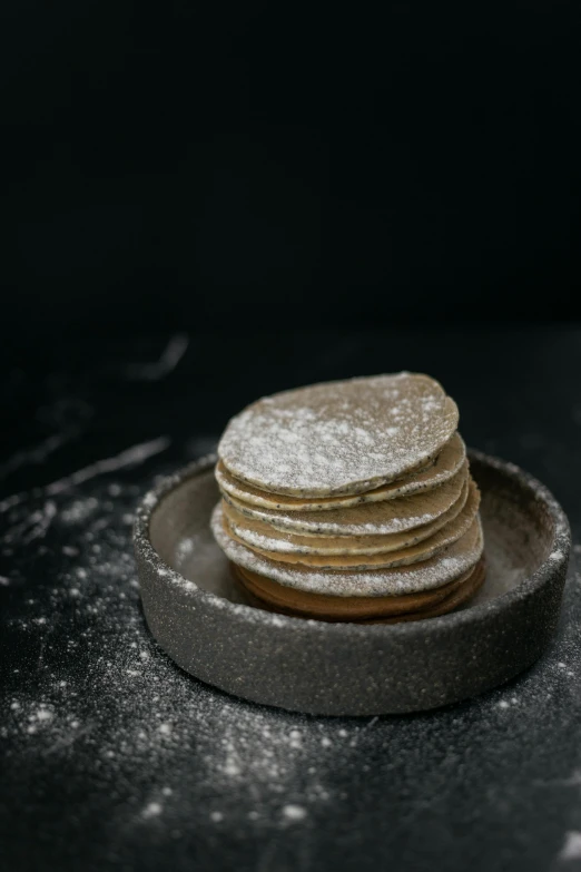 a stack of pancakes sitting on top of a plate, inspired by Modest Urgell, unsplash, renaissance, powdered sugar, high quality photo, thumbnail, colombian