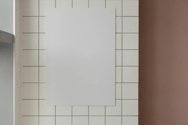 a picture hanging on a wall in a bathroom, a poster, inspired by Agnes Martin, unsplash, bauhaus, made of all white ceramic tiles, whiteboards, aluminium, blank paper