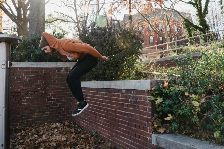 a man flying through the air while riding a skateboard, by Carey Morris, unsplash, doing a kickflip over stairs, bricks flying, nature outside, emily rajtkowski