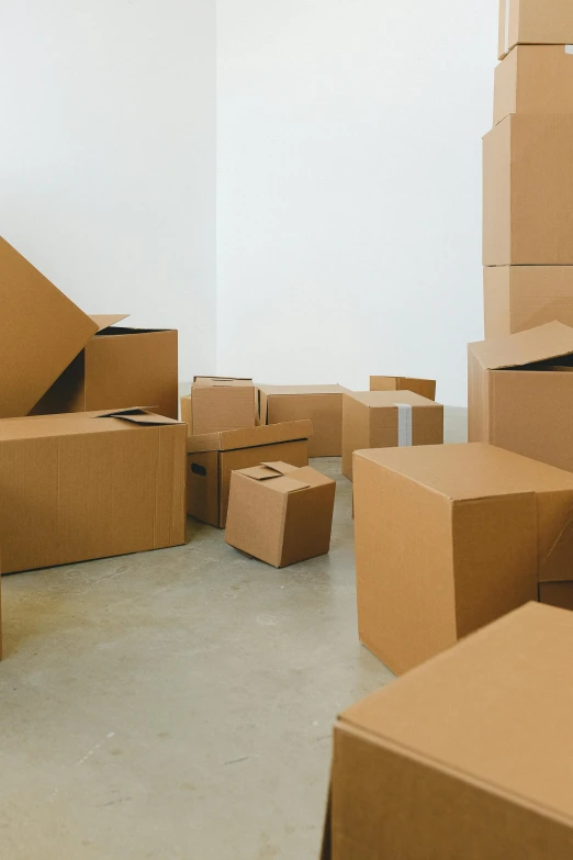 a room filled with lots of cardboard boxes, postminimalism, kailee mandel, plain background, brown, commercial