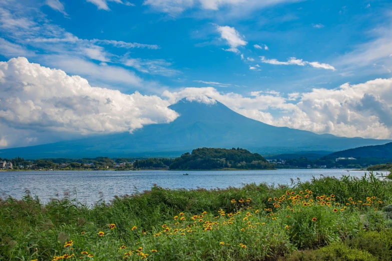 a body of water with a mountain in the background, by Aguri Uchida, pexels contest winner, shin hanga, pyramid surrounded with greenery, volcanoes in the background, wide river and lake, thumbnail