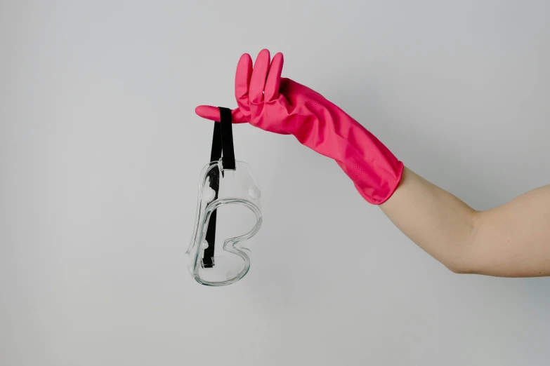 a person in pink gloves holding a spray bottle, inspired by Allan Ramsay, unsplash, plasticien, glass-cast heart, holding magical kitchen knives, clean photorealistic realistic, official product photo