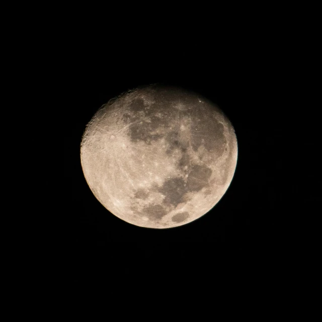 the moon is lit up in the dark sky, pexels, fan favorite, craters, half length shot, brown