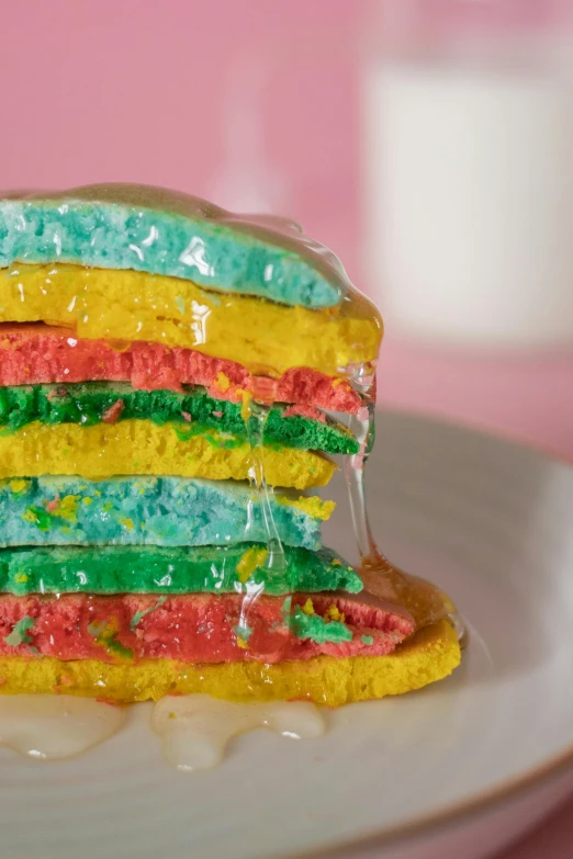 a stack of cake sitting on top of a white plate, a colorized photo, unsplash, color field, rainbow colored dust mask, pancakes, highly detailed closeup, 🍸🍋