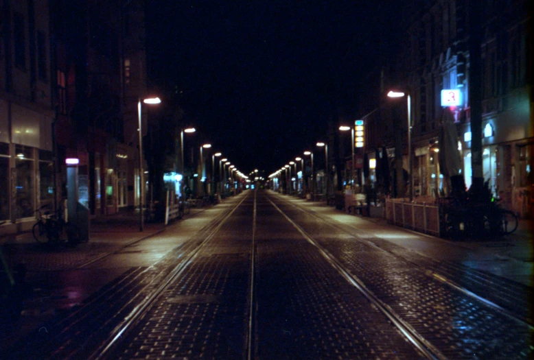 a city street filled with lots of traffic at night, an album cover, inspired by Thomas Struth, hyperrealism, in empty!!!! legnica, 35mm film still from 1994, medium format. soft light, tram