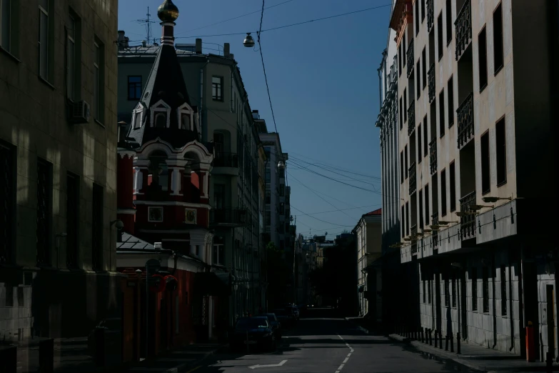 a city street filled with lots of tall buildings, an album cover, by Andrei Kolkoutine, unsplash, renaissance, russian architecture, contrast of light and shadows, 000 — википедия, summer street