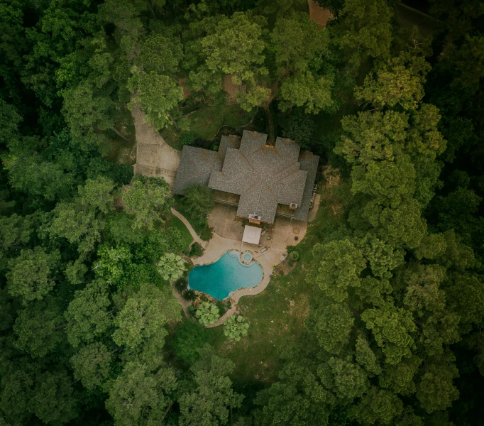 an aerial view of a house in the woods, a portrait, inspired by Elsa Bleda, pexels contest winner, renaissance, poolside, ron cobb, upscale photo, fan favorite