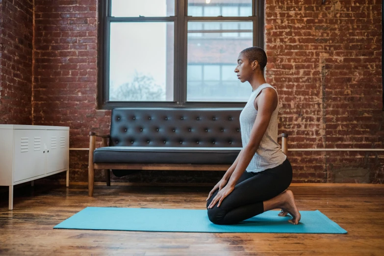 a woman sitting on a yoga mat in a living room, pexels contest winner, private press, marjaryasana and bitilasana, profile image, city views, thumbnail