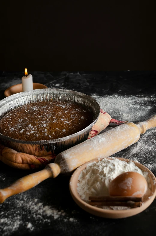 a pan of pie sitting on top of a table, a still life, inspired by Jan Kupecký, renaissance, dripping candles, salt, mortar and pestle, official product photo