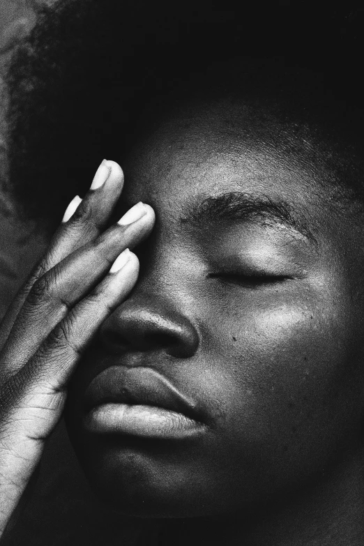 a black and white photo of a woman with her eyes closed, by Clifford Ross, pexels contest winner, visual art, black teenage boy, sleek hands, bruce weber, african facial features