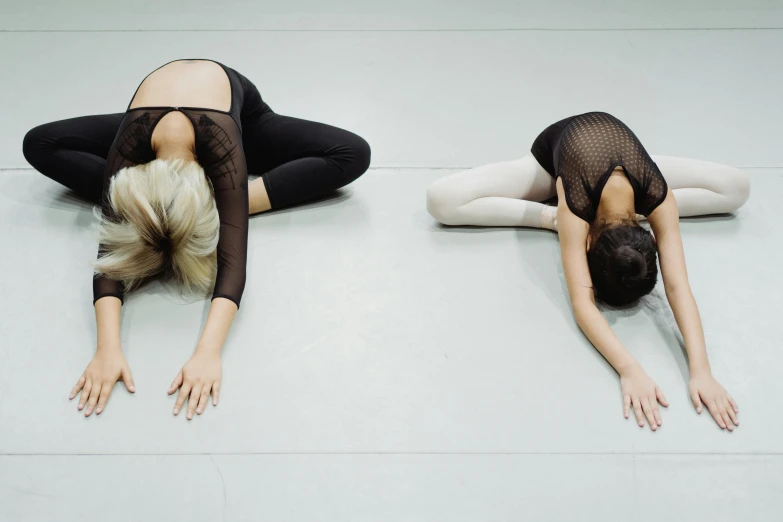 a couple of women laying on top of each other, unsplash, arabesque, stretching to walls, studio floor, 15081959 21121991 01012000 4k, back to back