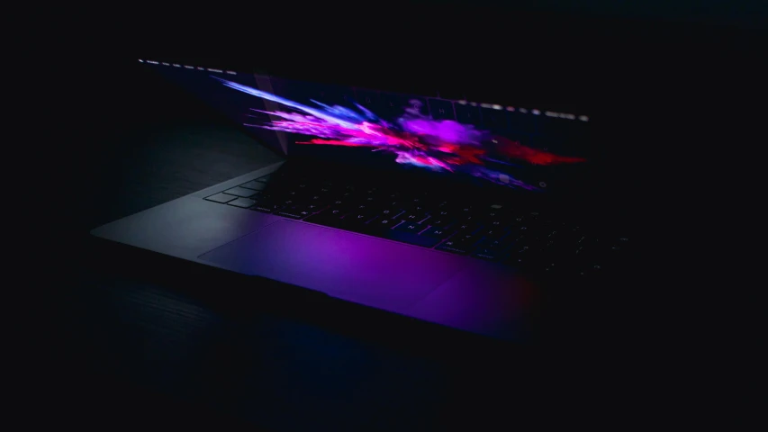 a laptop computer sitting on top of a table, pexels, computer art, purple neon colours, purple and black, opening shot, abstract lighting