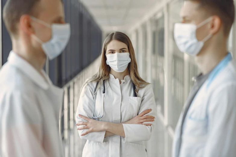 a couple of doctors standing next to each other, a picture, by Emma Andijewska, shutterstock, renaissance, worksafe. instagram photo, partially masked, in a row, nurse girl