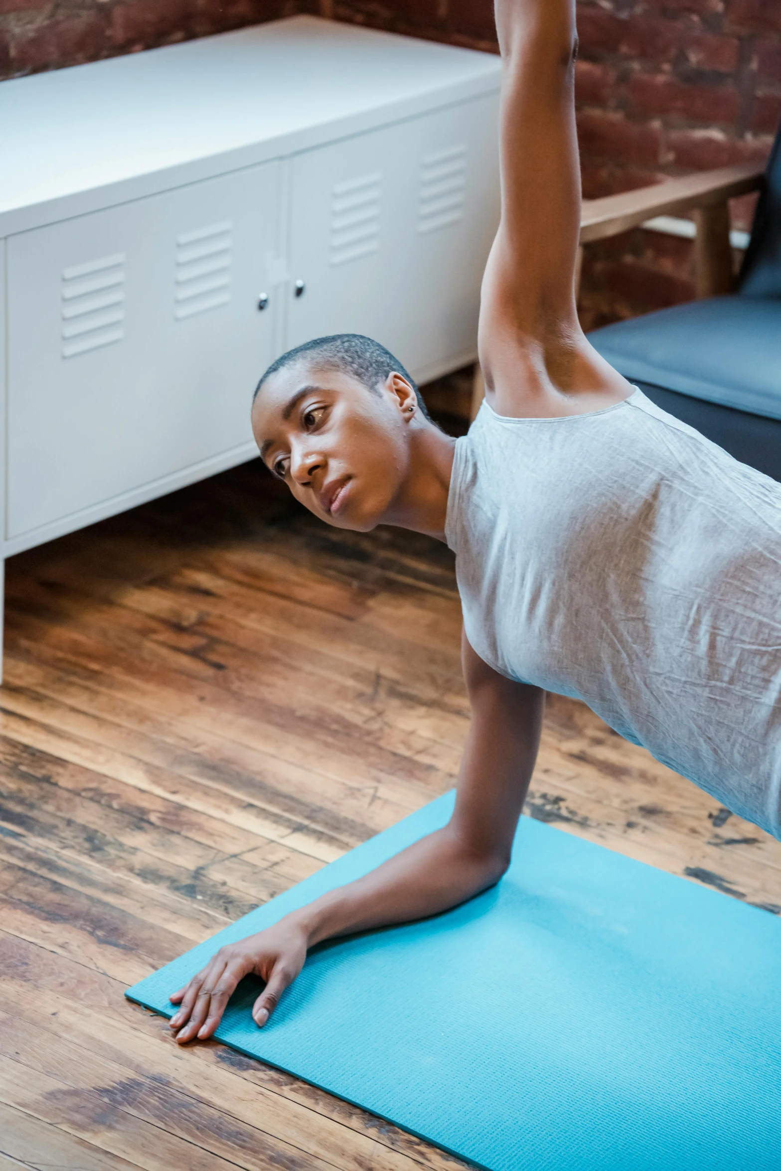 a woman doing an exercise on a yoga mat, by Carey Morris, jemal shabazz, low quality photo, nimble, extra high resolution