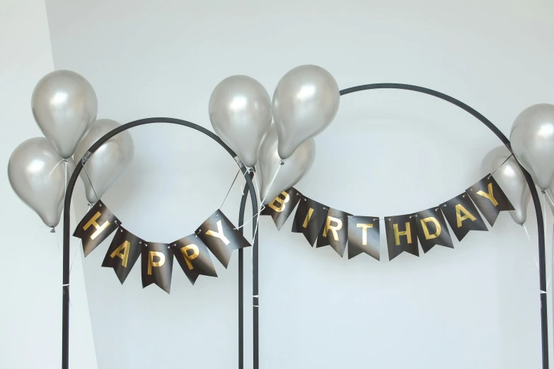 a bunch of balloons sitting on top of a table, gunmetal grey, circlet, full product shot, banners