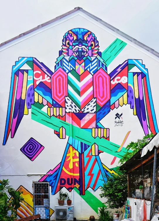 a colorful bird painted on the side of a building, by Okuda Gensō, pexels contest winner, thailand art, square, neon aztec, 🚿🗝📝