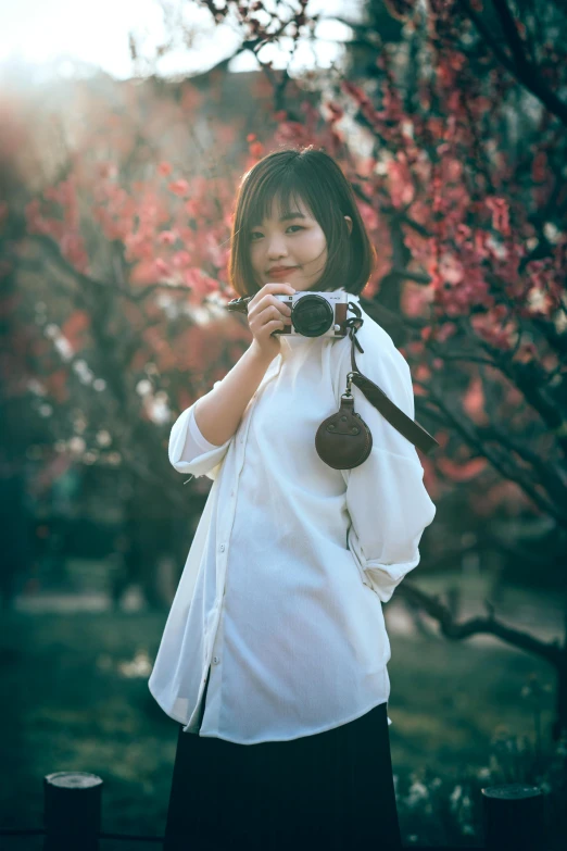 a woman taking a picture with a camera, inspired by Ma Yuanyu, wearing a white button up shirt, sakura season, 5 0 0 px models, low quality photo