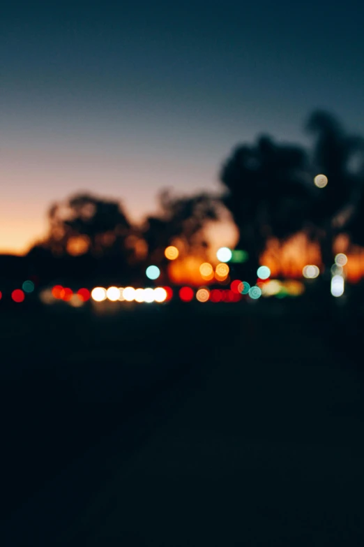 a blurry photo of a city at night, unsplash, suburb, sunset ligthing, overcast bokeh - c 5, bokeh ”