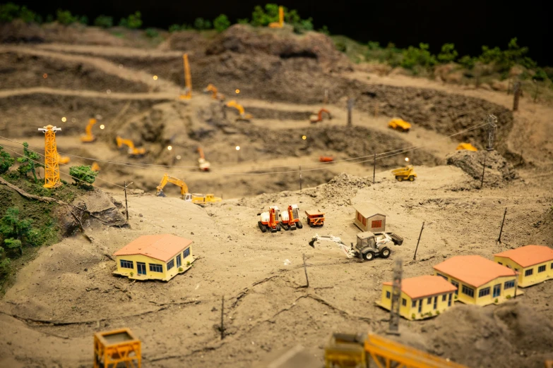 a model of a construction site with construction equipment, by Romain brook, moody mining planet, display item, people at work, promo image