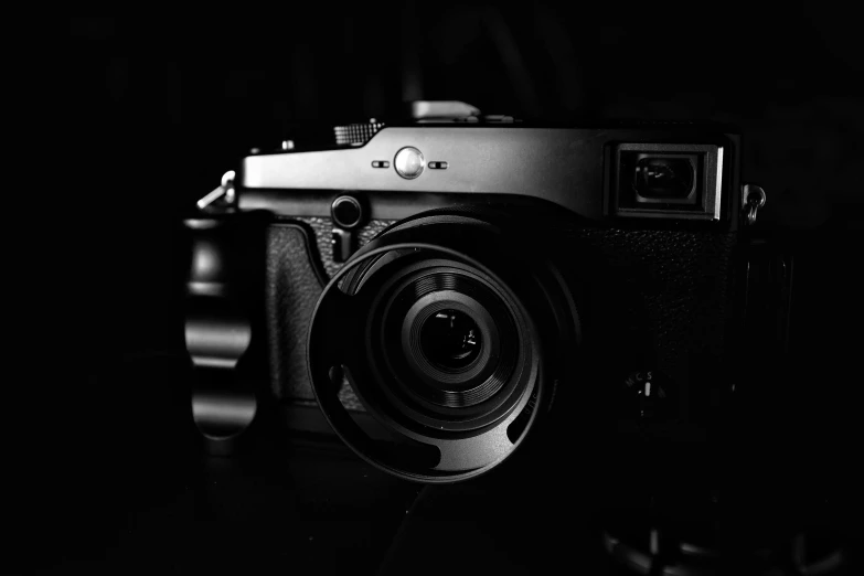 a black and white photo of a camera, by Matthias Weischer, unsplash contest winner, a portrait of @hypnos_onc, anime style mixed with fujifilm, bronze!! (eos 5ds r, medium format