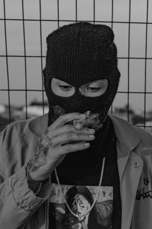 a man in a ski mask eating a donut, an album cover, inspired by Zhu Da, unsplash, realism, outside alone smoking weed, bw, street gang, headshot profile picture