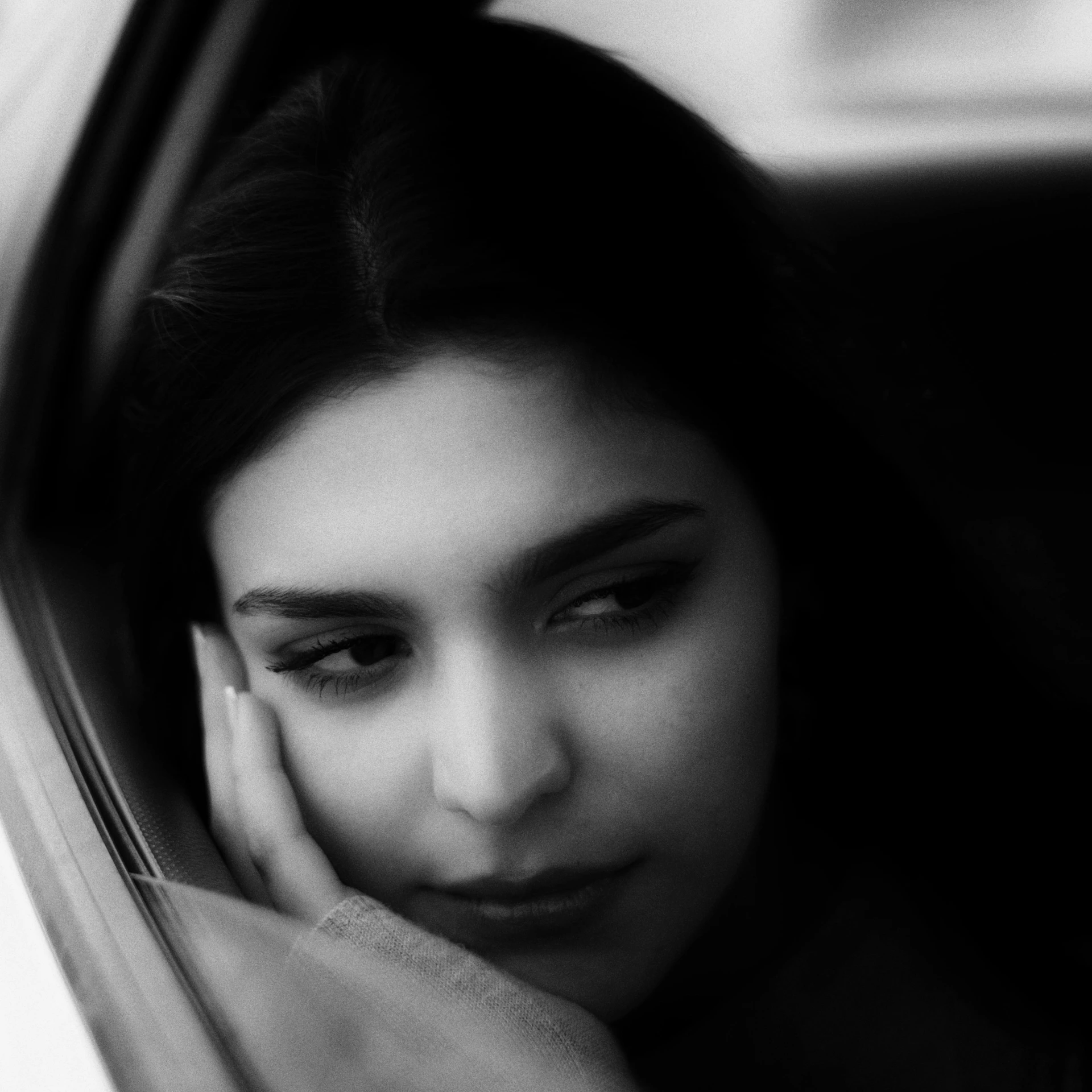 a black and white photo of a woman in a car, by irakli nadar, pexels contest winner, portrait of depressed teen, shohreh aghdashloo, maya ali, soft portrait shot 8 k