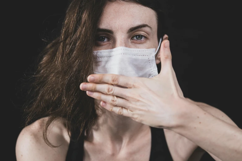 a woman with a face mask covering her mouth, pexels contest winner, antipodeans, white bandages on fists, thumbnail, biological photo, adult