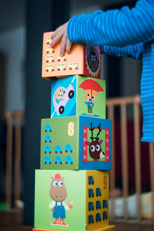a child playing with a stack of blocks, a cartoon, by Jesper Knudsen, pexels contest winner, square, fully decorated, detail shot, intarsia