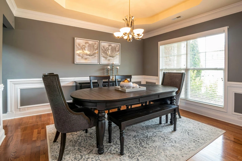 a dining room with a table and chairs, by Carey Morris, unsplash contest winner, pristine clean design, charcoal and silver color scheme, high details photo, real estate photography