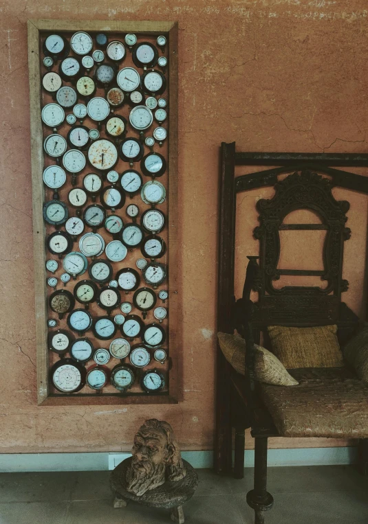 a chair sitting in front of a wall with clocks on it, kinetic art, buttons, assamese aesthetic, full frame image, instagram photo