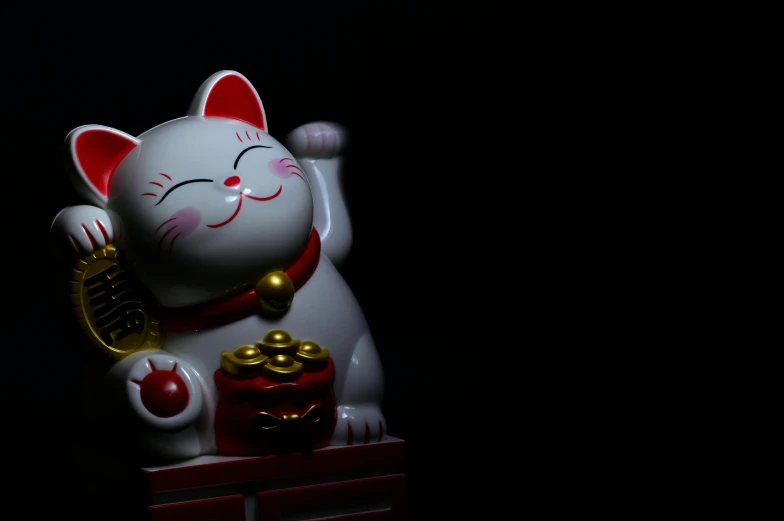 a close up of a figurine of a cat, inspired by Kanō Naizen, pexels contest winner, standing with a black background, feng shui, 3d animated, bells